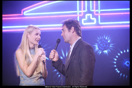 Gwyneth Paltrow (L) with Huey Lewis (R)