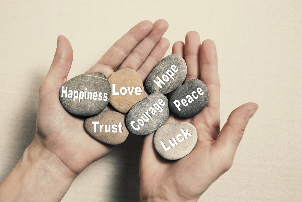 Hand With Inspirational Stones